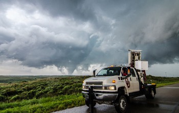 The scientists scan a possible tornado-producing supercell in Kansas at sunset.